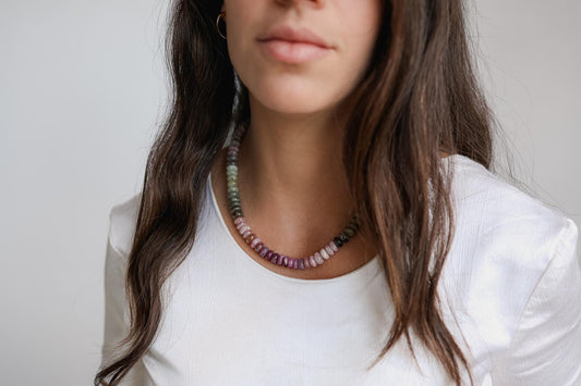 Elegant Wild Bloom Sapphire Necklace from Earthly Abundance featuring a vibrant blue sapphire pendant on a delicate chain.