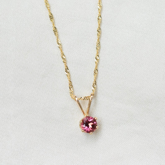 Pink Tourmaline necklace featuring a pendant on a delicate chain, showcasing vibrant pink gemstones from Earthly Abundance.