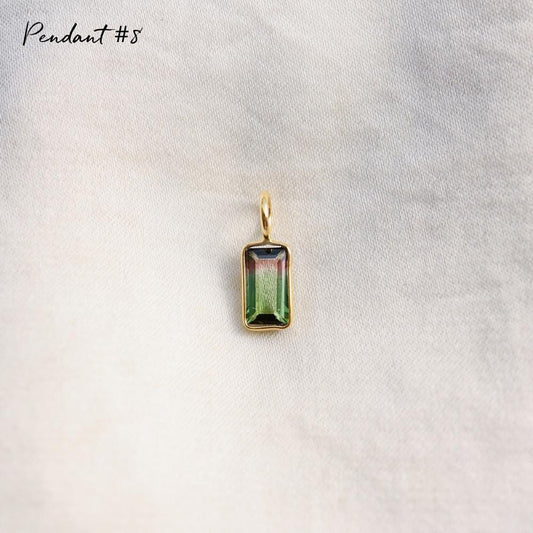 Earthly Abundance bi-color tourmaline pendant featuring a unique, vibrant gemstone on a delicate chain.