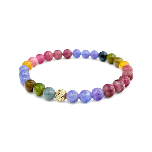 Earthly Abundance Cosmic Candy bracelet featuring colorful tourmaline and tanzanite gemstones in a stylish jewelry design.