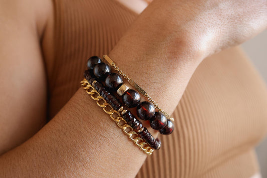 Garnet bracelet with 10mm beads from Earthly Abundance, featuring polished deep red gemstones on a stretch cord.