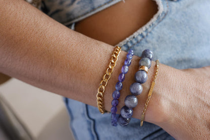 Earthly Abundance Iolite Bracelet with 10mm round gemstones, showcasing a stylish and elegant jewelry accessory.