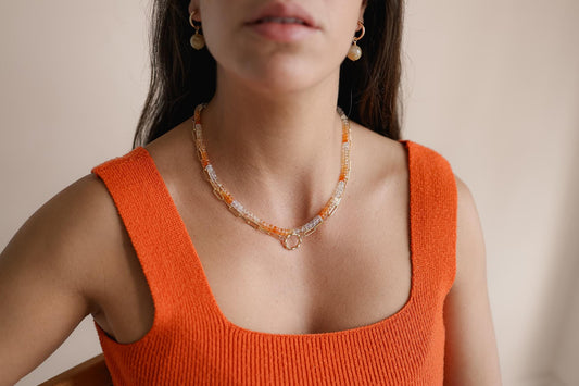 Ombre Mexican Fire Opal necklace with vibrant orange and red stones on a silver chain, from Earthly Abundance.