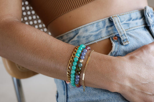 Earthly Abundance cosmic candy bracelet featuring colorful tourmaline and tanzanite gemstones on a delicate silver chain.