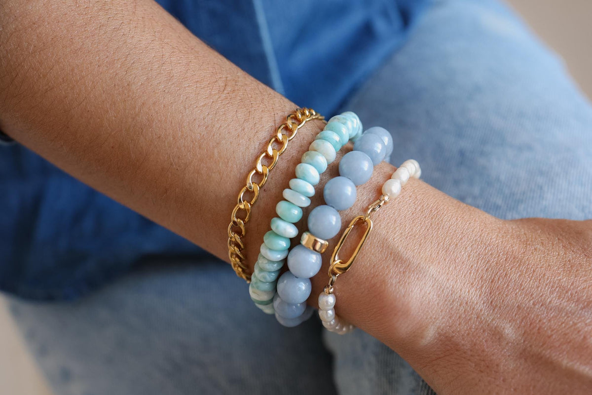 Larimar rondel bracelet by Earthly Abundance featuring blue gemstone beads on a delicate elastic band.