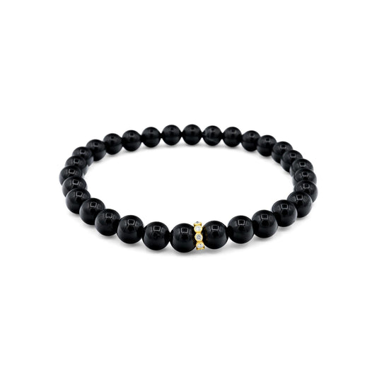 14K gold diamond and black tourmaline bracelet from Earthly Abundance with sparkling gemstones and delicate chain design.