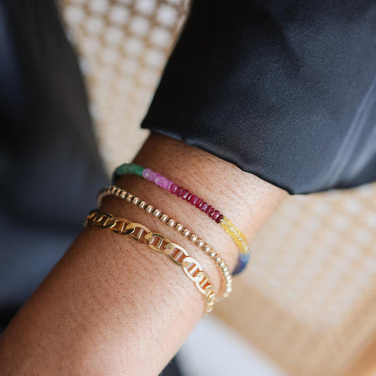 Colorful multi-gem bracelet featuring sapphires, rubies, and emeralds from Earthly Abundance Jewelry.