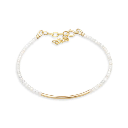 Earthly Abundance moonstone bar bracelet featuring smooth moonstone beads and a sleek metal bar design on a delicate chain.