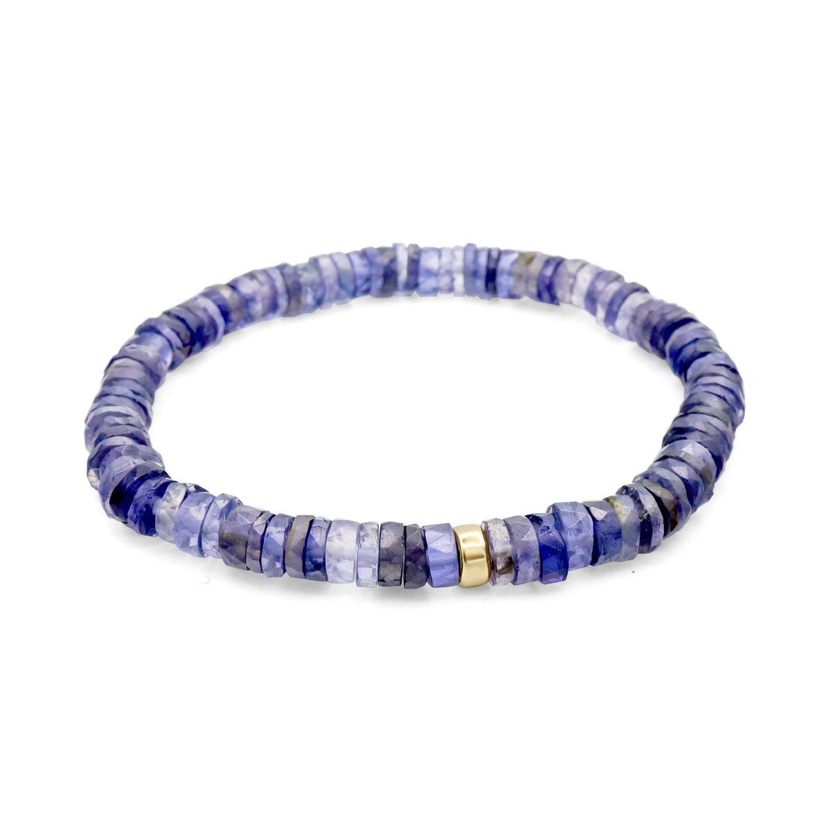 Iolite Heishi bracelet with 5mm beads from Earthly Abundance, featuring round, smooth violet-blue stones on an elastic band.