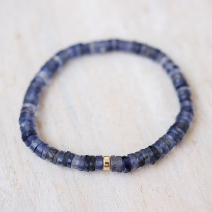 Iolite Heishi bracelet with 5mm round beads from Earthly Abundance displayed on a neutral background.
