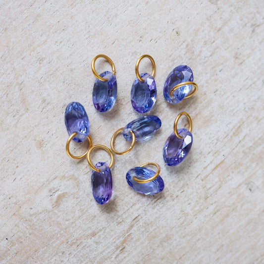 Elegant Tanzanite pendant necklace in 14K gold featuring a vibrant blue gemstone and delicate chain.
