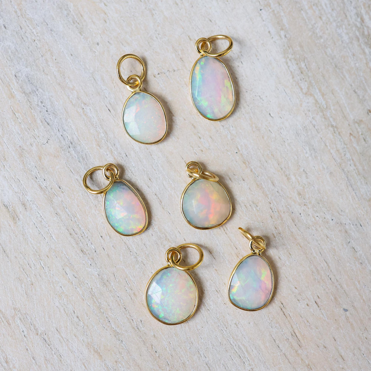 Ethiopian Opal Necklace featuring a 14K gold chain and vibrant opal pendant, showcased on a neutral background.
