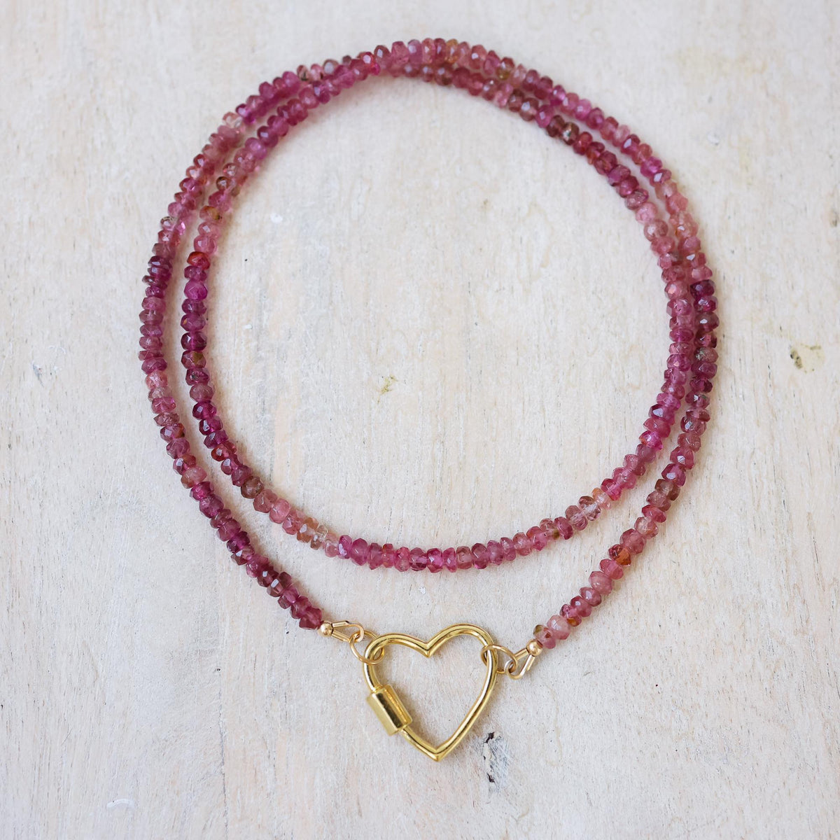 Raspberry tourmaline heart carabiner necklace by Earthly Abundance on a chain
