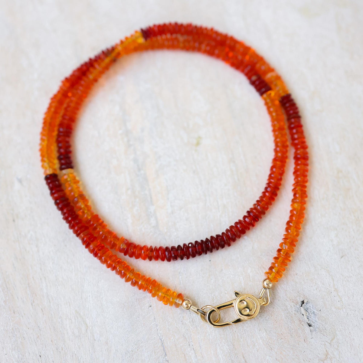 Earthly Abundance Sunset Fire Opal Smiley Necklace with a colorful opal pendant on a delicate chain