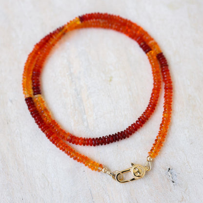 Earthly Abundance Sunset Fire Opal Smiley Necklace with a colorful opal pendant on a delicate chain