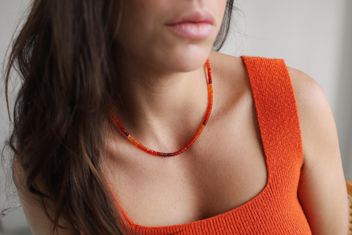 Sunset Fire Opal Smiley Necklace by Earthly Abundance, featuring a colorful opal smiley face pendant
