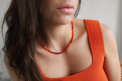 Sunset Fire Opal Smiley Necklace by Earthly Abundance, featuring a colorful opal smiley face pendant