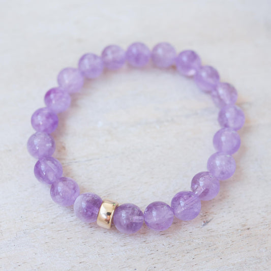 Lilac Haze Amethyst Bracelet by Earthly Abundance, featuring polished purple amethyst beads