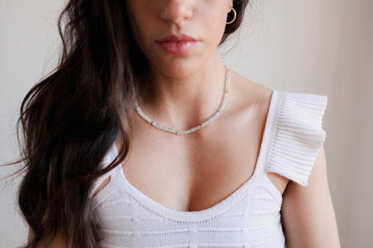 Blue Topaz Heishi necklace from Earthly Abundance featuring small, round blue topaz beads strung together in a delicate design.