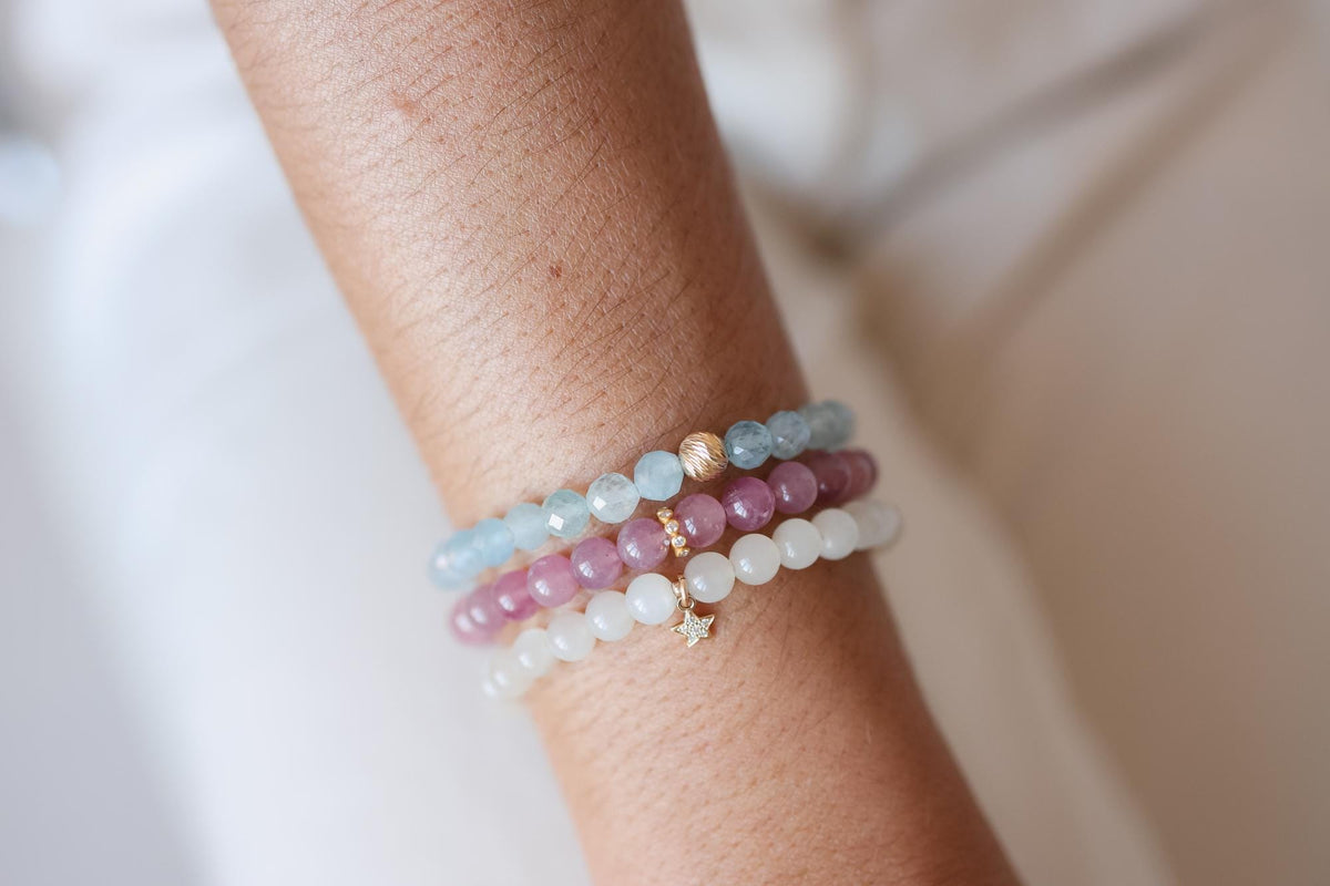 Faceted aquamarine bracelet by Earthly Abundance featuring shimmering blue stones on a delicate silver chain.