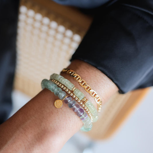 Prehnite Glow Bracelet by Earthly Abundance featuring polished green prehnite stones on an elastic band.