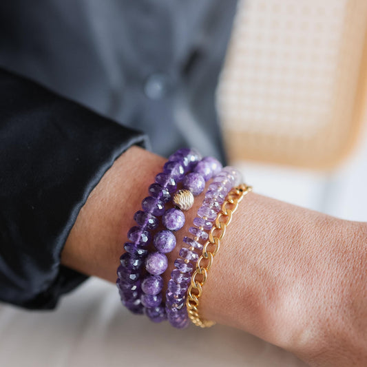 Amethyst Heishi Ombre bracelet by Earthly Abundance featuring graduated purple and lavender beads on an elastic band.