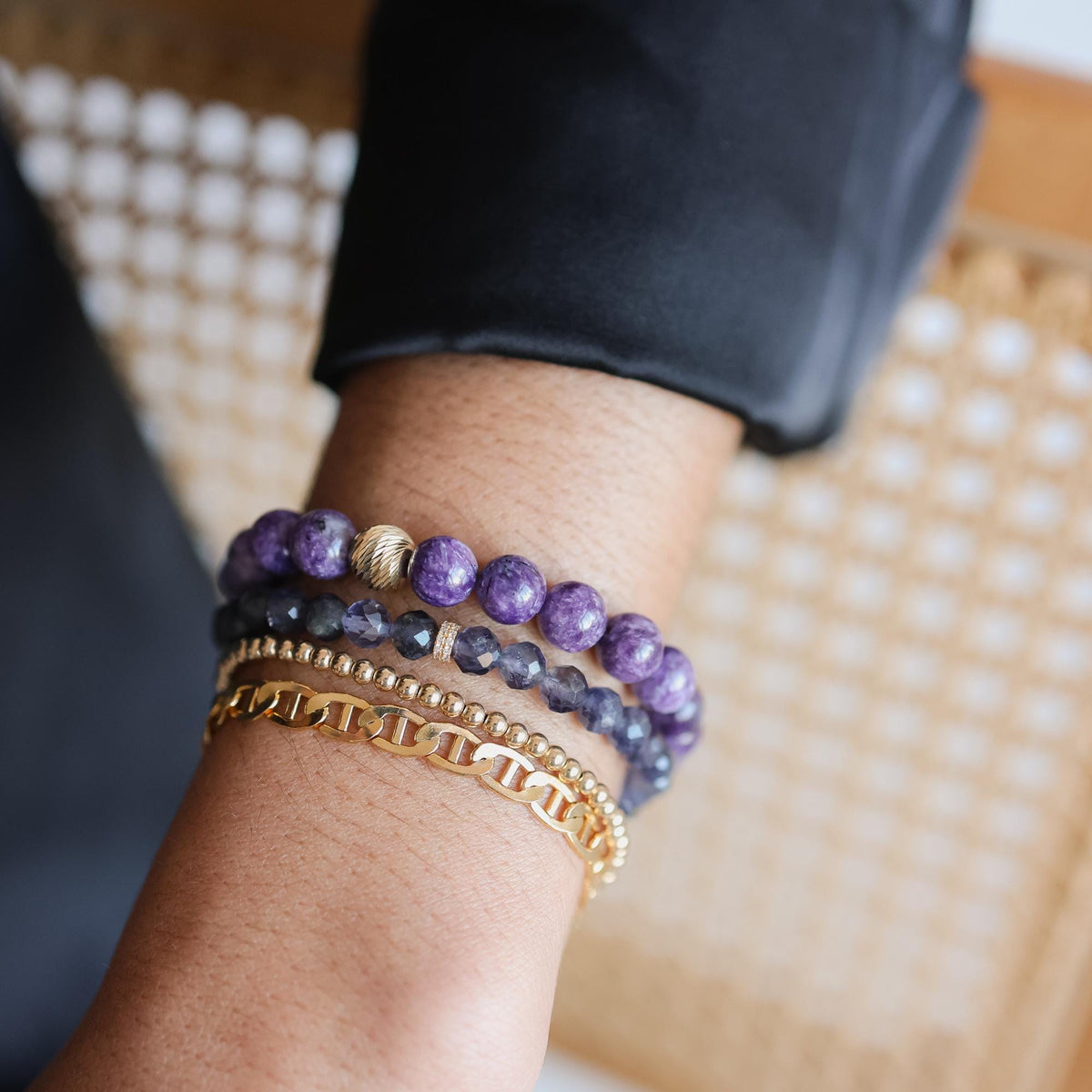 8mm Charoite bracelet from Earthly Abundance featuring polished purple stones on an elastic band.