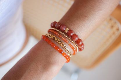 Golden Ember Sunstone bracelet with 14K gold accents from Earthly Abundance, featuring warm, shimmering sunstone beads.